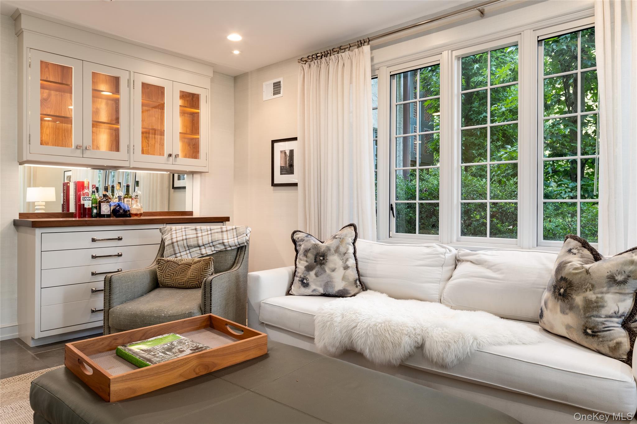 42 Masterton Road Bronxville, NY 10708 - Photo 16 of 36 a living room with furniture and a large window
