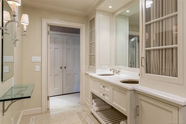 a view of bathroom with dual sinks
