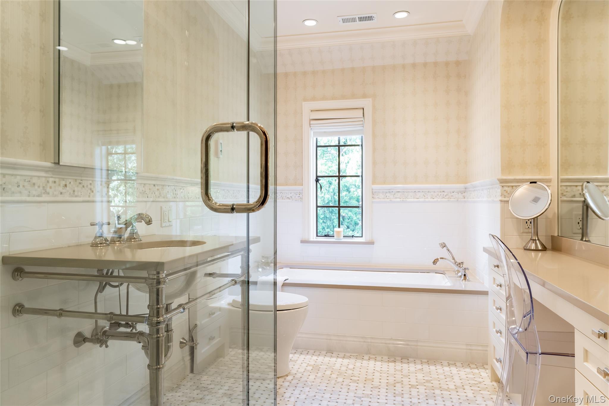 42 Masterton Road Bronxville, NY 10708 - Photo 24 of 36 a bathroom with a tub sink and mirror