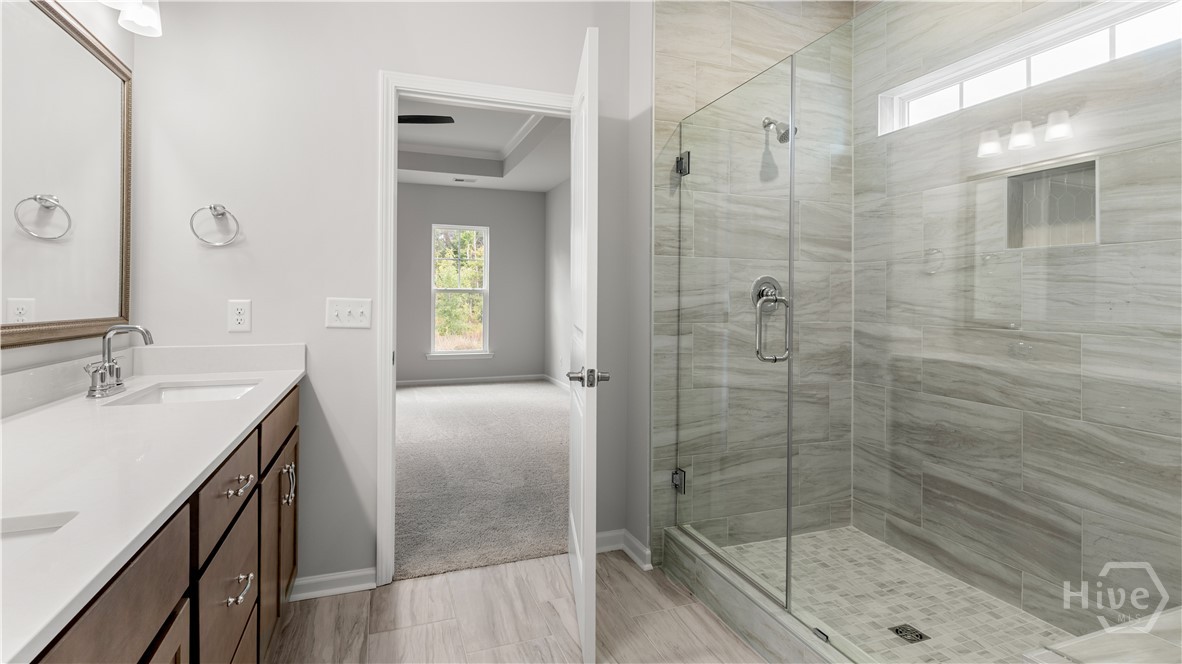 146 Como Drive Pooler, GA 31322 - Photo 9 of 23 Primary bath with Quartz countertops and walk in tiled shower