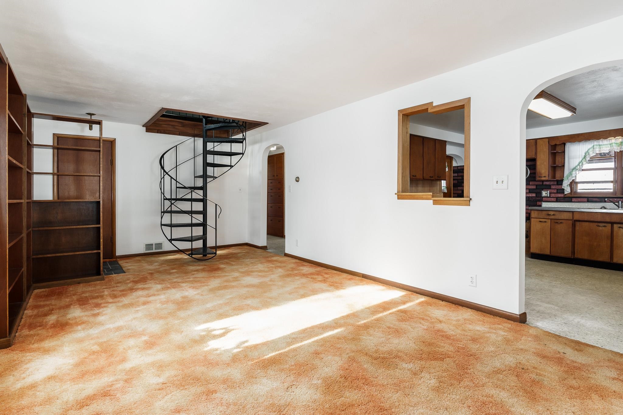 9189 Pomeroy Road Rockton, IL 61072 - Photo 5 of 34 a view of a livingroom with an empty space and kitchen space