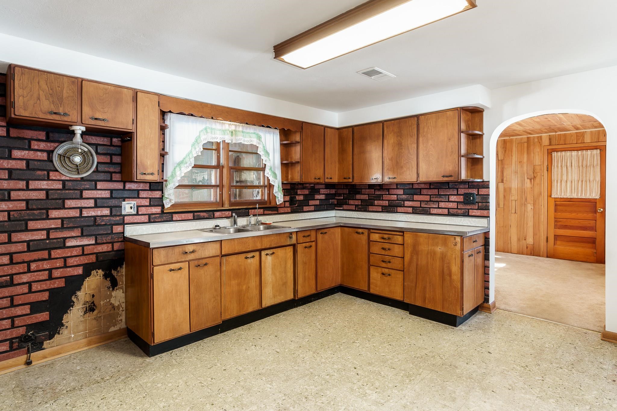 9189 Pomeroy Road Rockton, IL 61072 - Photo 6 of 34 a kitchen with stainless steel appliances granite countertop a stove a sink and a microwave