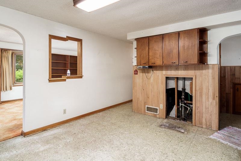 9189 Pomeroy Road Rockton, IL 61072 - Photo 8 of 34 a view of an empty room with a fireplace and a window