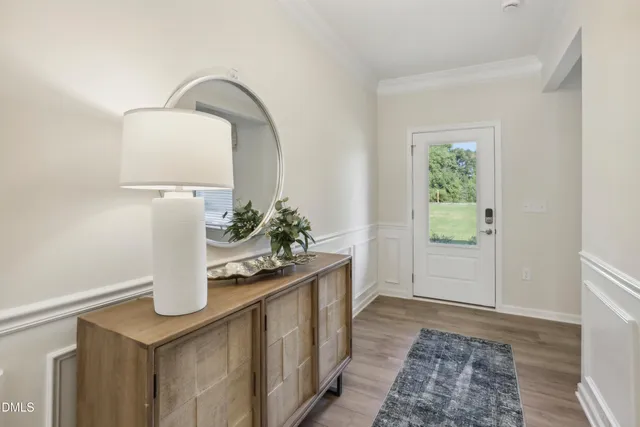 a room with a sink and a mirror