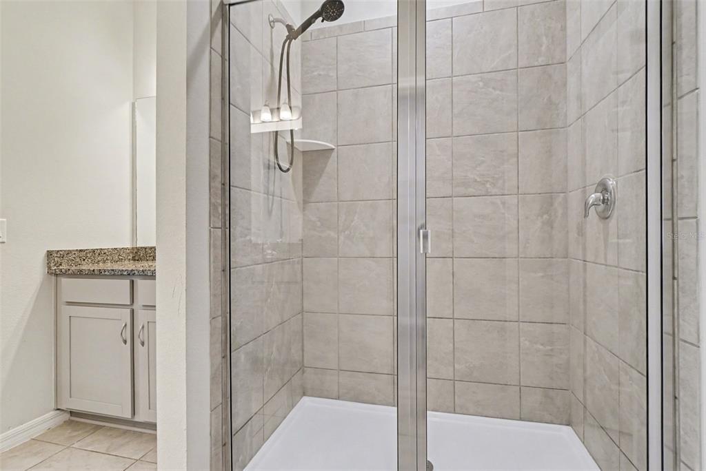 2735 Rowan Street Tavares, FL 32778 - Photo 27 of 32 a bathroom with a shower