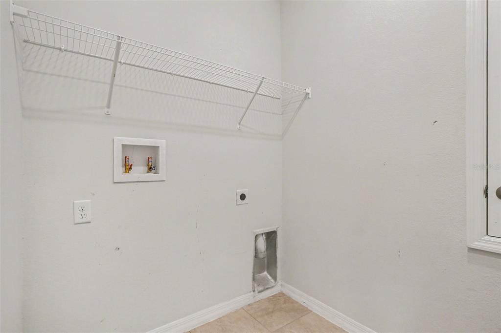 2735 Rowan Street Tavares, FL 32778 - Photo 28 of 32 a view of small space with empty racks