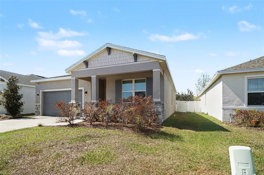 2735 Rowan Street Tavares, FL 32778 - Photo 3 of 32 a front view of house with yard