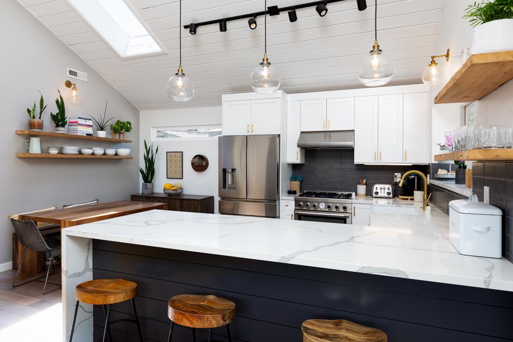 220 Aptos Beach Drive Aptos, CA 95003 - Photo 7 of 21 a kitchen with stainless steel appliances a stove refrigerator and cabinets