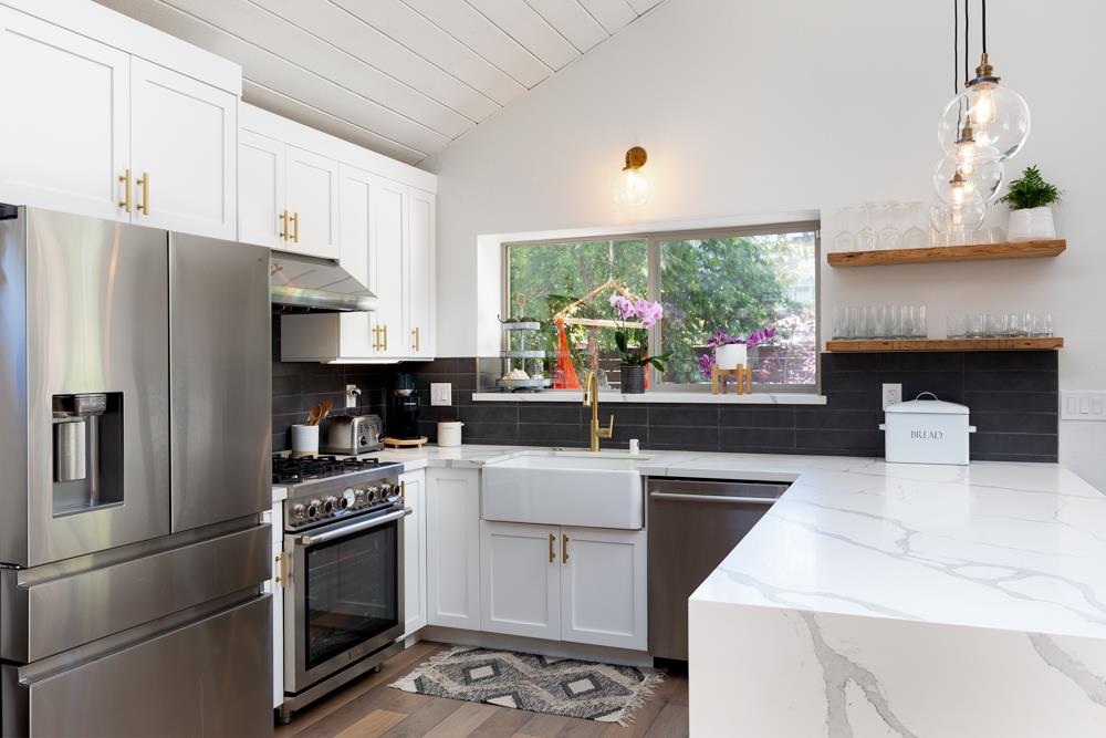 220 Aptos Beach Drive Aptos, CA 95003 - Photo 8 of 21 a kitchen with a stove a sink and a refrigerator