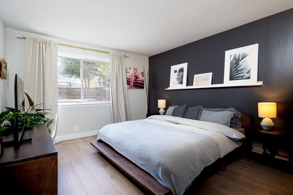 220 Aptos Beach Drive Aptos, CA 95003 - Photo 9 of 21 a bedroom with a large bed and a potted plant