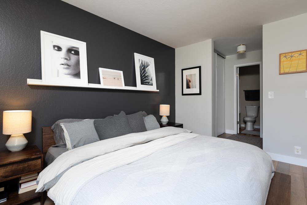 220 Aptos Beach Drive Aptos, CA 95003 - Photo 10 of 21 a bedroom with a bed and wall paintings