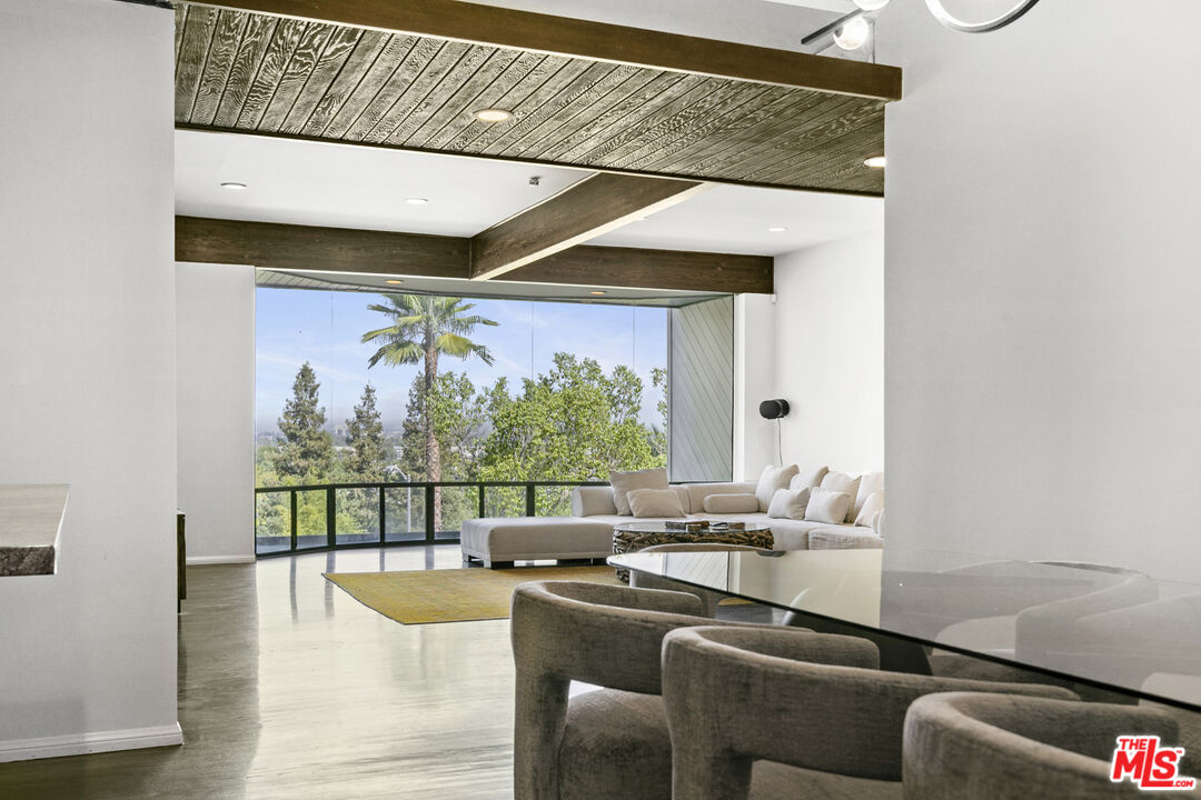 13952 Valley Vista Boulevard Sherman Oaks, CA 91423 - Photo 14 of 44 a dining room with furniture and a large window