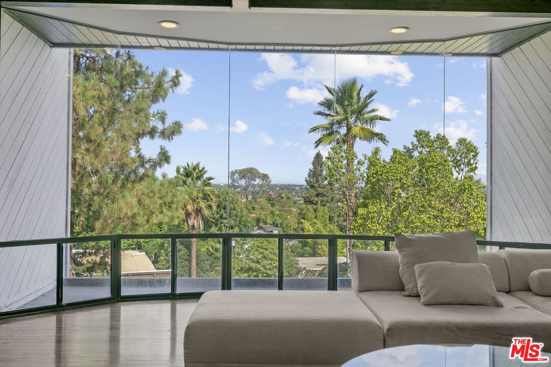 13952 Valley Vista Boulevard Sherman Oaks, CA 91423 - Photo 17 of 44 a balcony with furniture and a potted plant