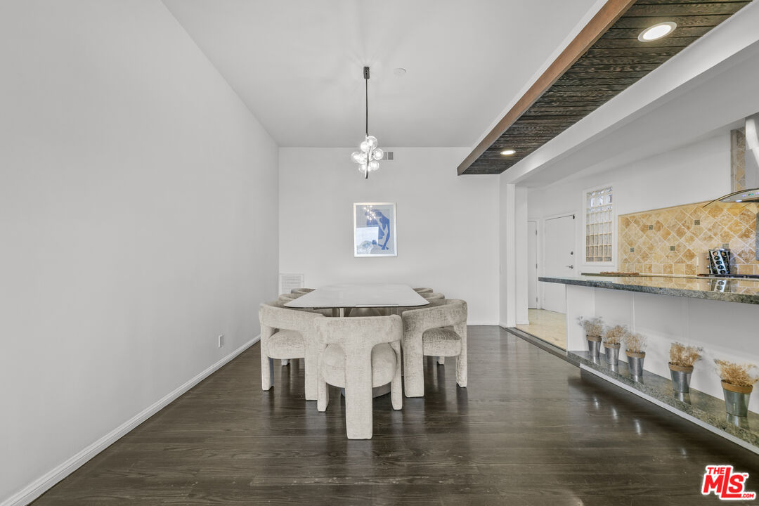 13952 Valley Vista Boulevard Sherman Oaks, CA 91423 - Photo 19 of 44 a view of a dining room with furniture and wooden floor