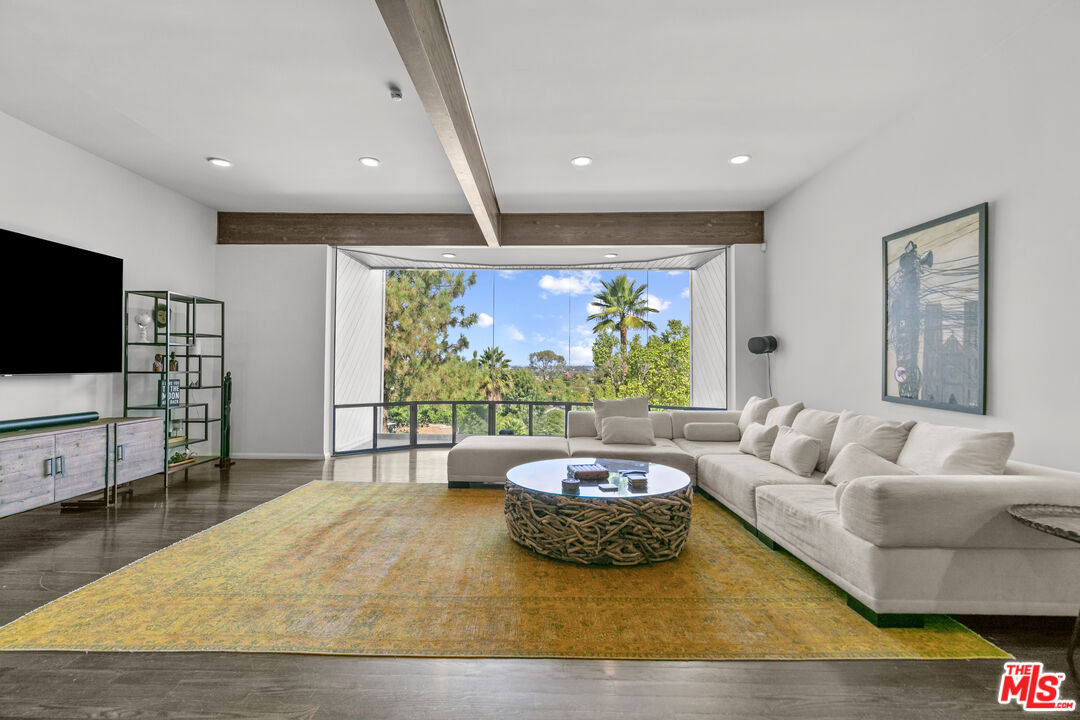 13952 Valley Vista Boulevard Sherman Oaks, CA 91423 - Photo 20 of 44 a living room with furniture and a flat screen tv