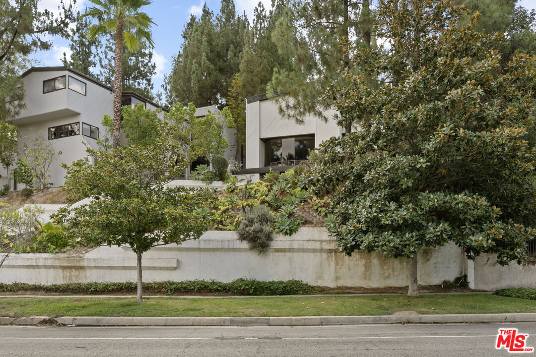 13952 Valley Vista Boulevard Sherman Oaks, CA 91423 - Photo 2 of 44 a front view of a house with a yard