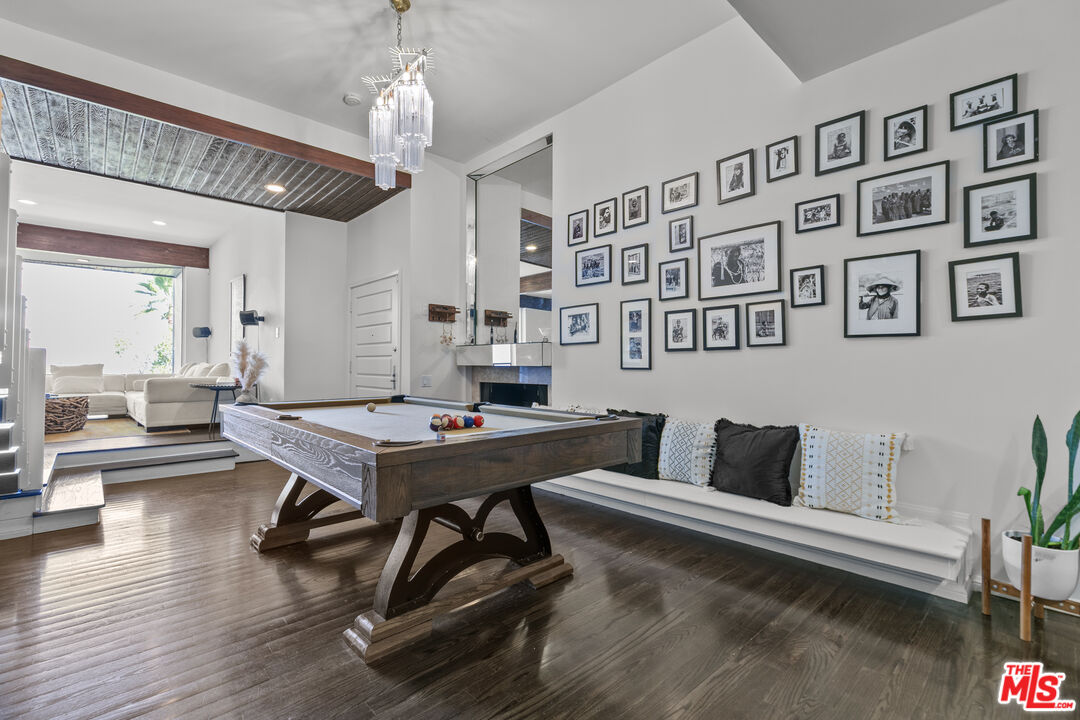 13952 Valley Vista Boulevard Sherman Oaks, CA 91423 - Photo 22 of 44 a living room with furniture and a chandelier