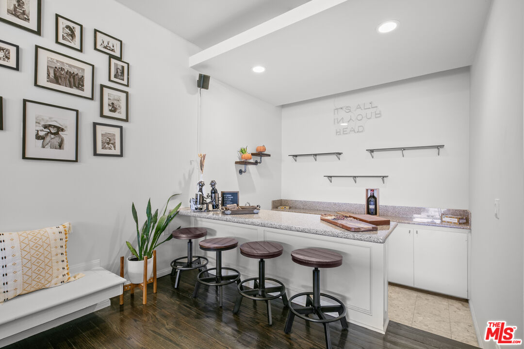 13952 Valley Vista Boulevard Sherman Oaks, CA 91423 - Photo 23 of 44 a view of a dining room with furniture and wooden floor