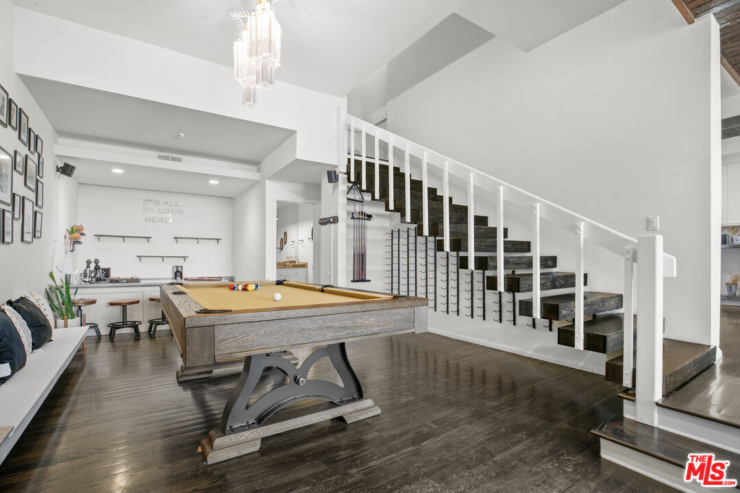 13952 Valley Vista Boulevard Sherman Oaks, CA 91423 - Photo 24 of 44 a dining room with furniture wooden floor and a rug