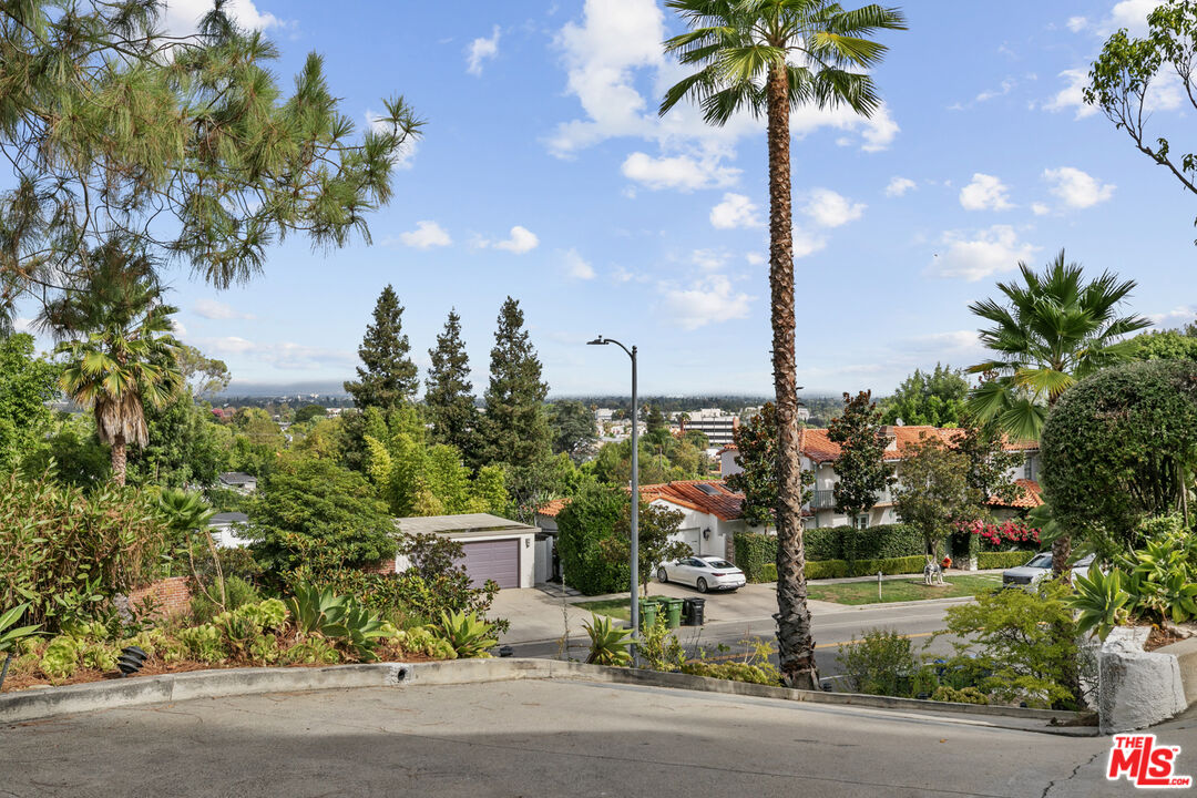 13952 Valley Vista Boulevard Sherman Oaks, CA 91423 - Photo 27 of 44 a front view of a house with garden