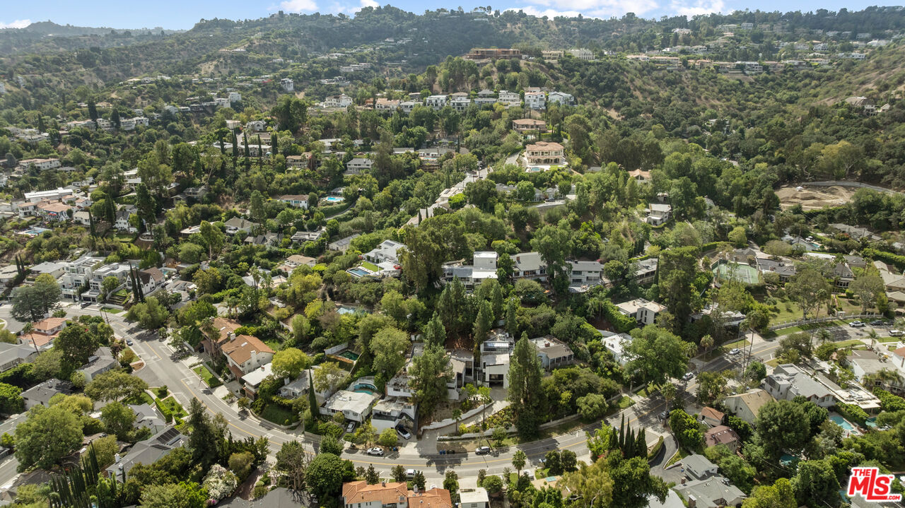 13952 Valley Vista Boulevard Sherman Oaks, CA 91423 - Photo 29 of 44 an aerial view of a houses with a lush green hillside