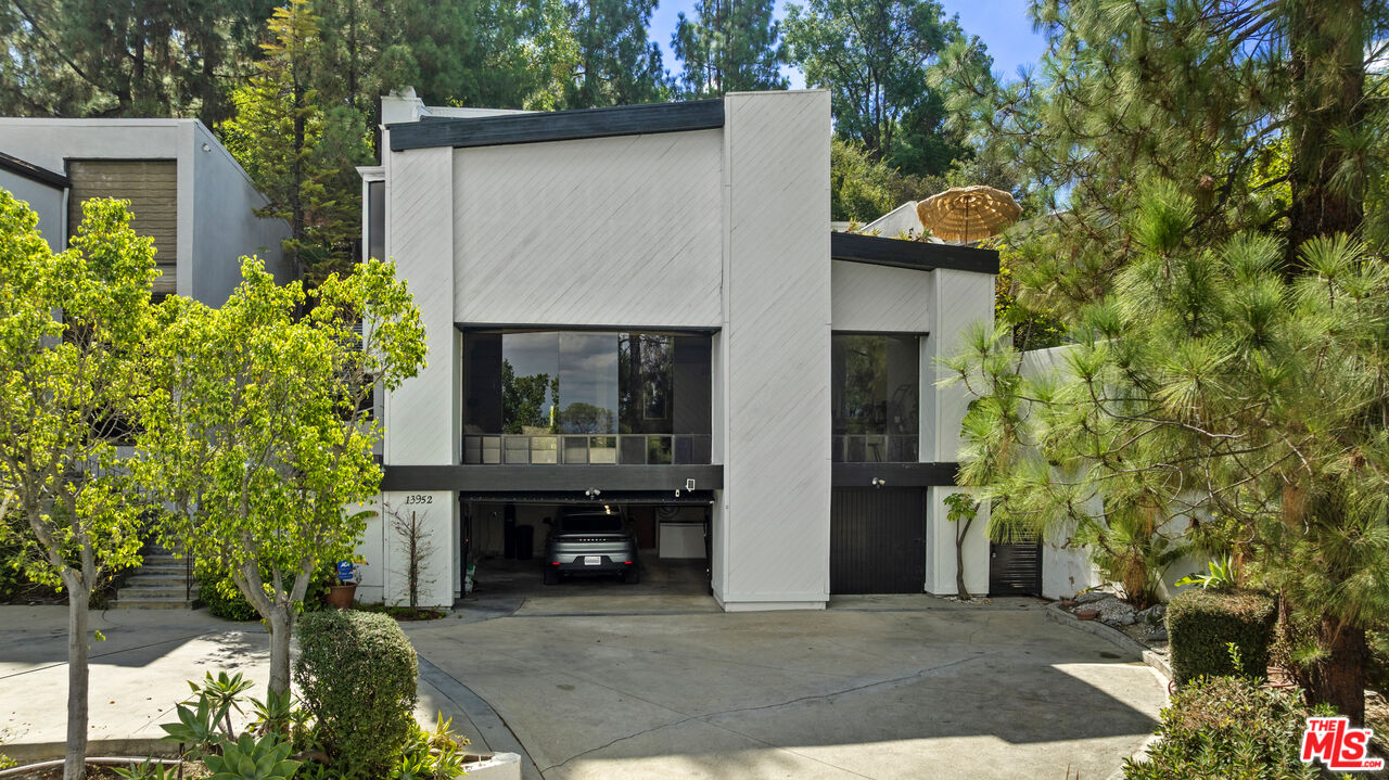 13952 Valley Vista Boulevard Sherman Oaks, CA 91423 - Photo 30 of 44 a front view of a house with garden