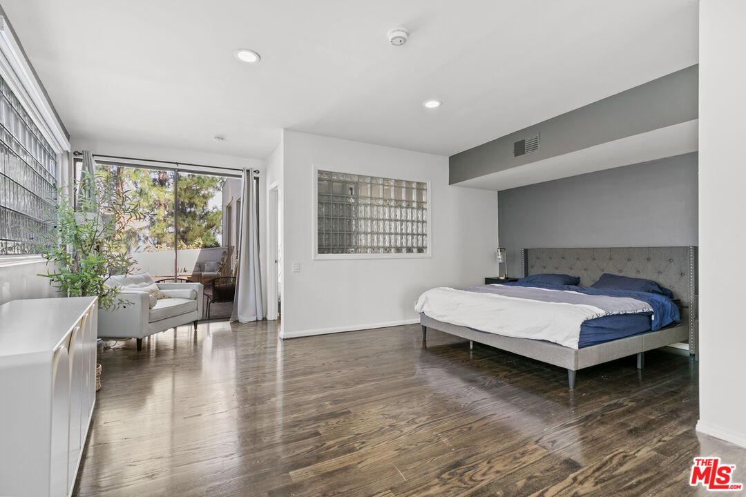 13952 Valley Vista Boulevard Sherman Oaks, CA 91423 - Photo 34 of 44 a living room with furniture and a fireplace