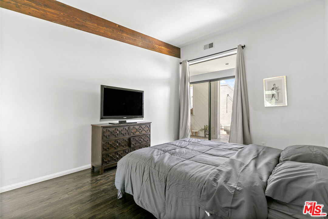 13952 Valley Vista Boulevard Sherman Oaks, CA 91423 - Photo 38 of 44 a bedroom with a bed and a flat screen tv