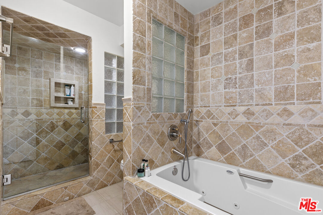 13952 Valley Vista Boulevard Sherman Oaks, CA 91423 - Photo 42 of 44 a bathroom with a bathtub and shower