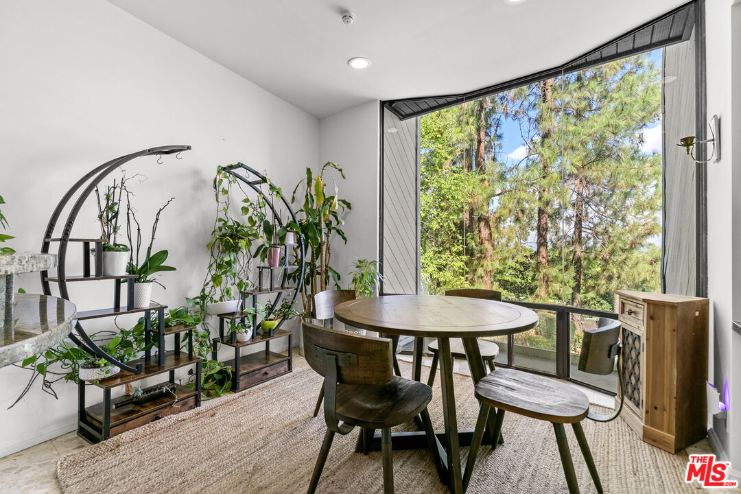 13952 Valley Vista Boulevard Sherman Oaks, CA 91423 - Photo 10 of 44 a view of a dining room with furniture window and wooden floor