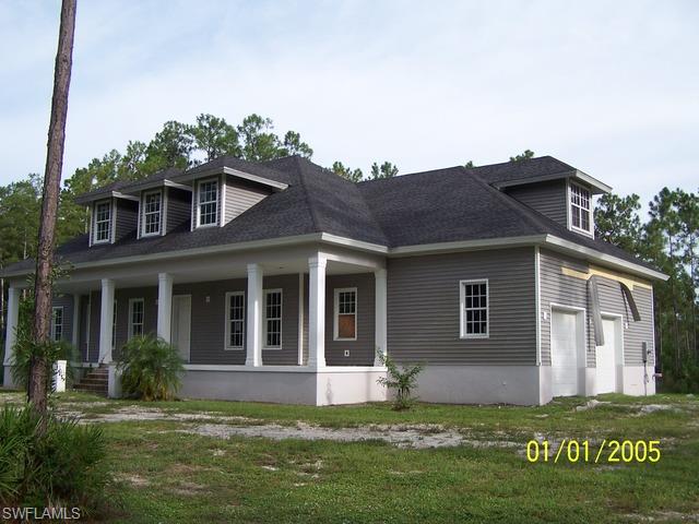 4620 8th Avenue Northeast Naples, FL 34120 - Photo 2 of 8 a view of a house with a yard