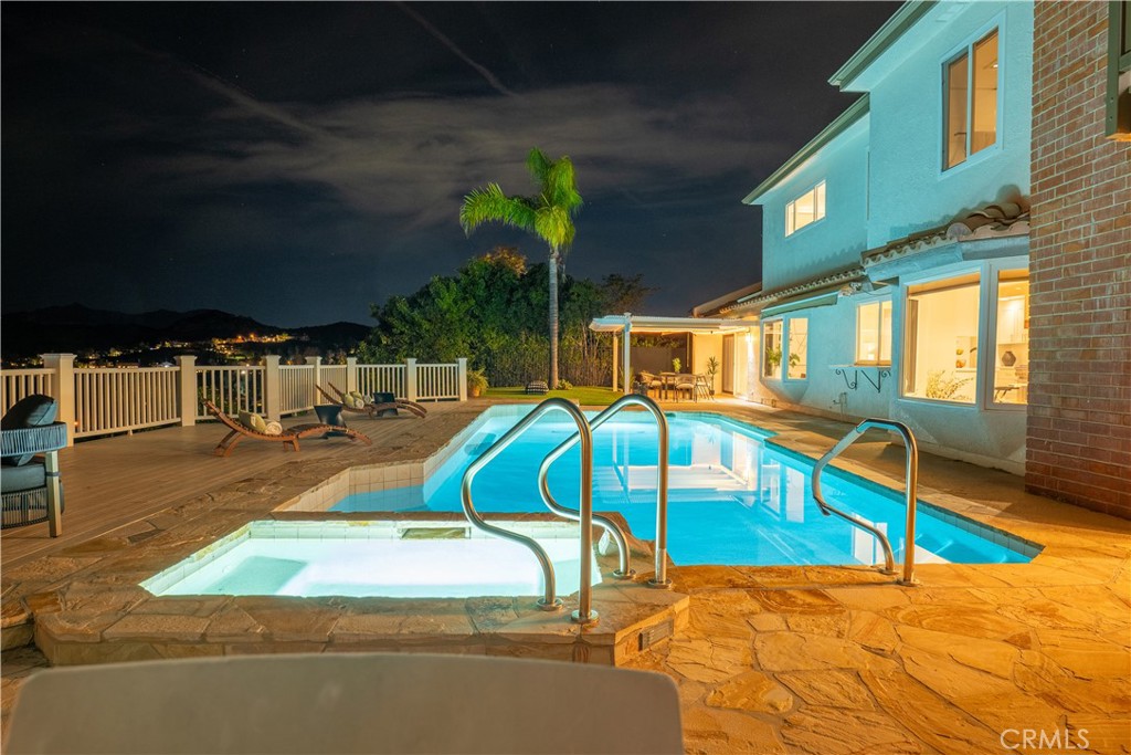 3563 Twin Lake Westlake Village, CA 91361 - Photo 2 of 54 a view of a swimming pool with a lounge chairs