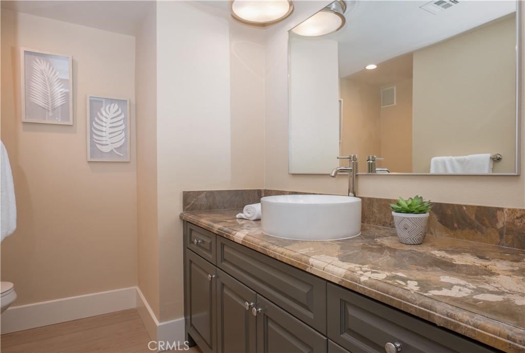 3563 Twin Lake Westlake Village, CA 91361 - Photo 22 of 54 a bathroom with a granite countertop sink and a mirror