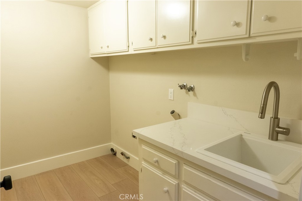 3563 Twin Lake Westlake Village, CA 91361 - Photo 23 of 54 a bathroom with a sink and cabinets