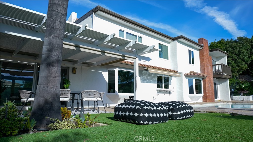 3563 Twin Lake Westlake Village, CA 91361 - Photo 35 of 54 a front view of a house with a garden