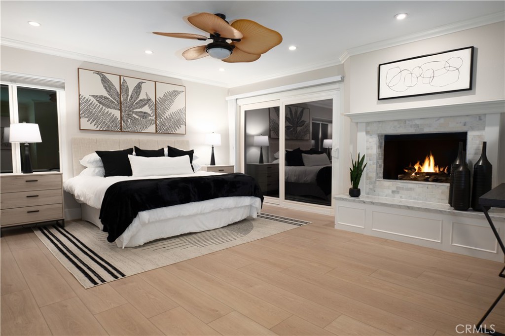 3563 Twin Lake Westlake Village, CA 91361 - Photo 41 of 54 a bedroom with a large bed and a fireplace