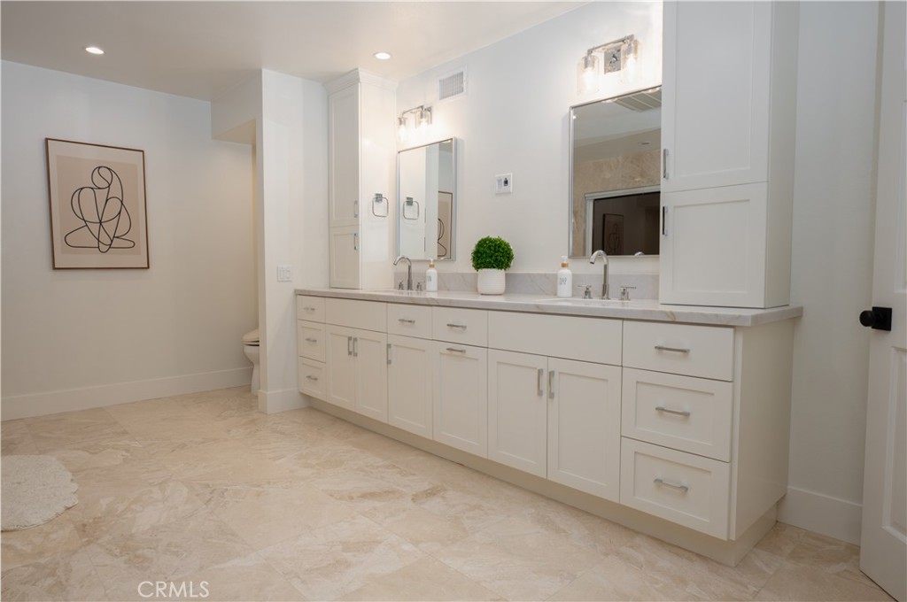 3563 Twin Lake Westlake Village, CA 91361 - Photo 43 of 54 a spacious bathroom with a double vanity sink and mirror
