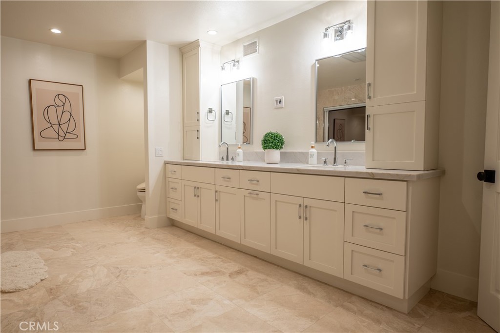3563 Twin Lake Westlake Village, CA 91361 - Photo 44 of 54 a spacious bathroom with a double vanity sink and a mirror
