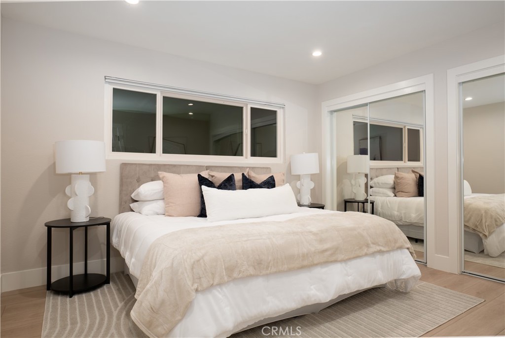 3563 Twin Lake Westlake Village, CA 91361 - Photo 47 of 54 a bedroom with a large bed and a large window