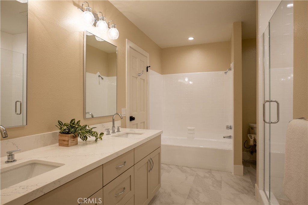 3563 Twin Lake Westlake Village, CA 91361 - Photo 50 of 54 a bathroom with a double vanity sink mirror double and shower