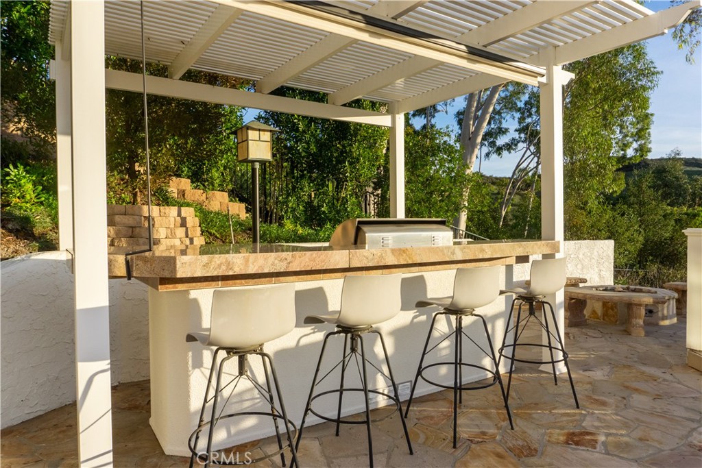 3563 Twin Lake Westlake Village, CA 91361 - Photo 5 of 54 a patio with table and chairs and potted plants