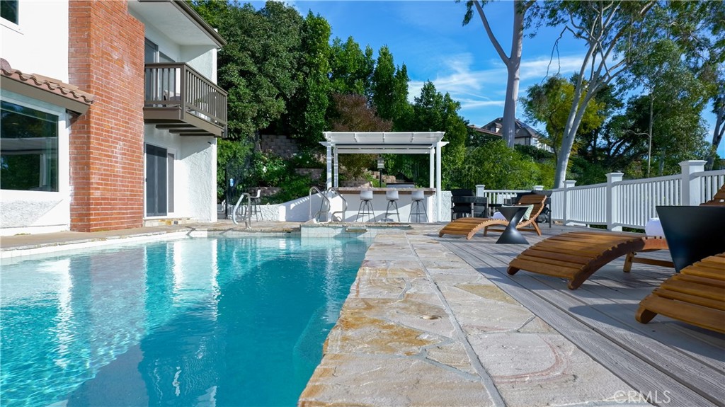 3563 Twin Lake Westlake Village, CA 91361 - Photo 8 of 54 a swimming pool with outdoor seating and barbeque oven