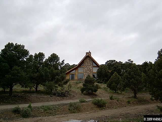 1850 Harte Road Reno, NV 89521 - Photo 3 of 9 a front view of a house with a yard