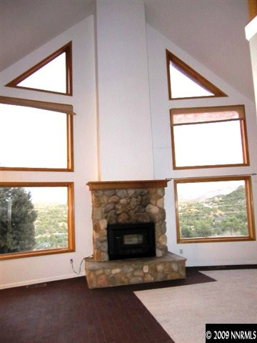 1850 Harte Road Reno, NV 89521 - Photo 6 of 9 a living room with a fireplace and a window