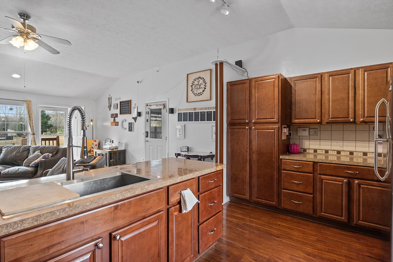1714 West Grab Creek Road Dickson, TN 37055 - Photo 14 of 26 a kitchen with refrigerator cabinets and wooden floor
