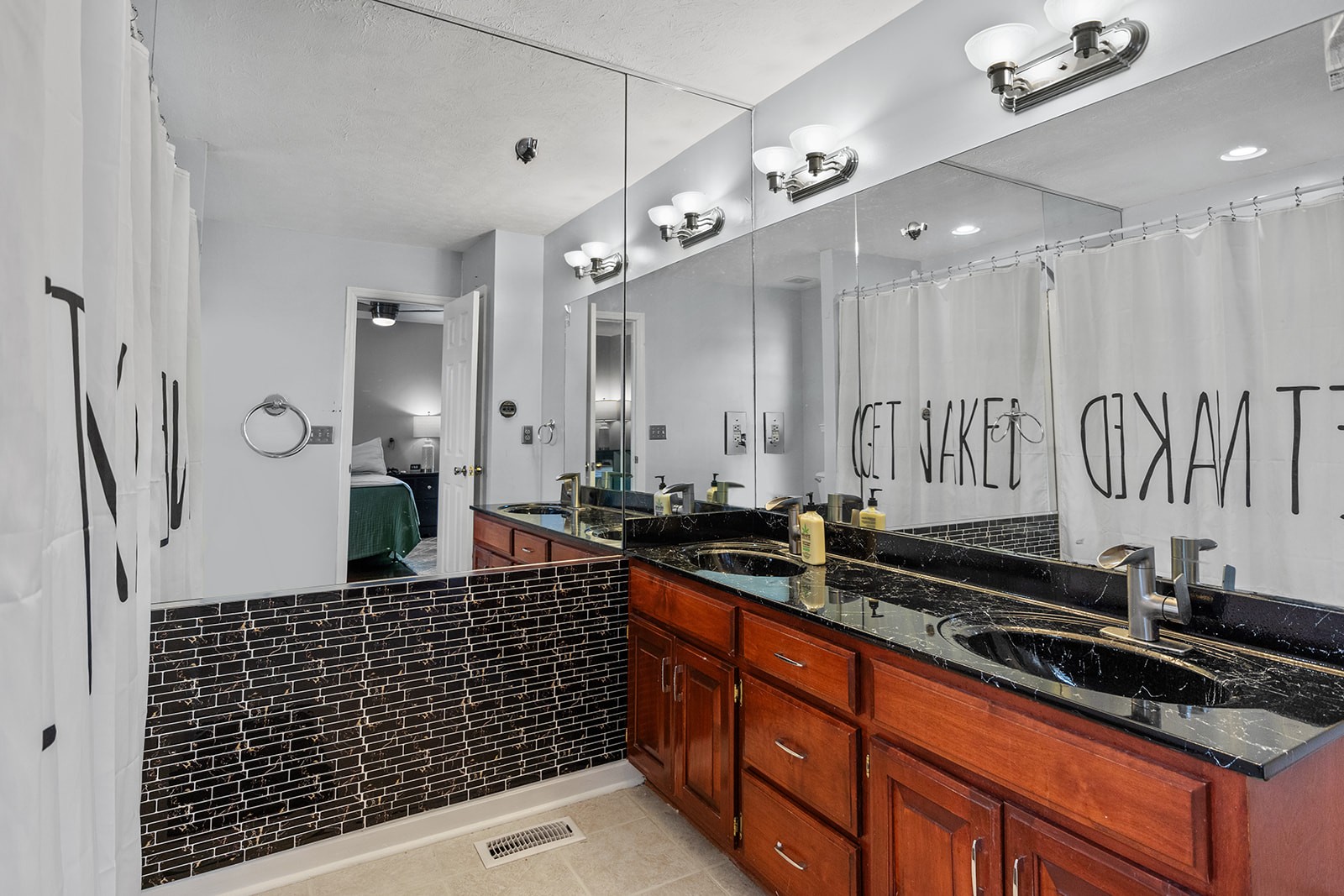 1714 West Grab Creek Road Dickson, TN 37055 - Photo 18 of 26 a bathroom with a sink a mirror and a shower