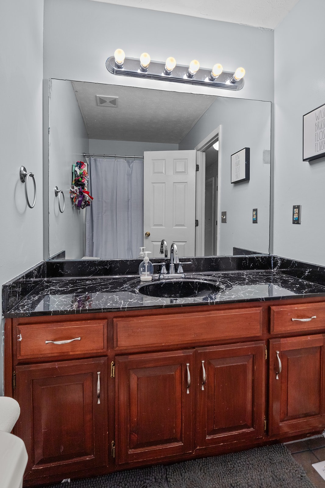 1714 West Grab Creek Road Dickson, TN 37055 - Photo 22 of 26 a bathroom with a sink and a mirror
