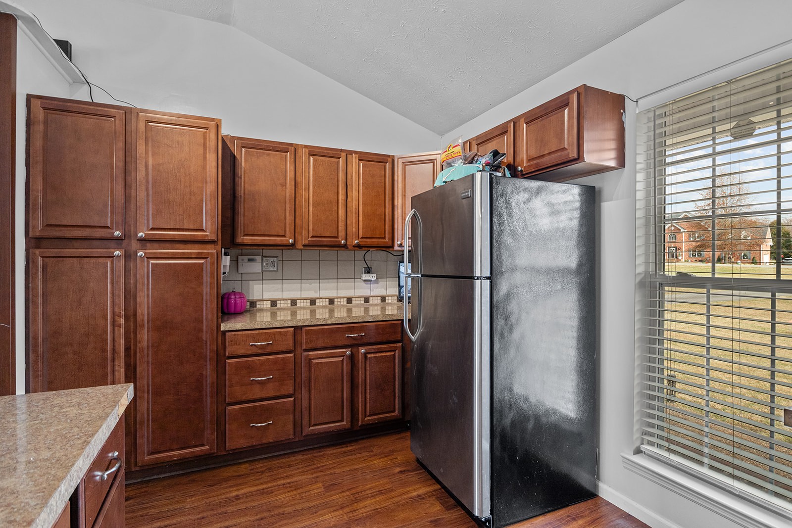 1714 West Grab Creek Road Dickson, TN 37055 - Photo 23 of 26 a kitchen with stainless steel appliances granite countertop a refrigerator and a stove