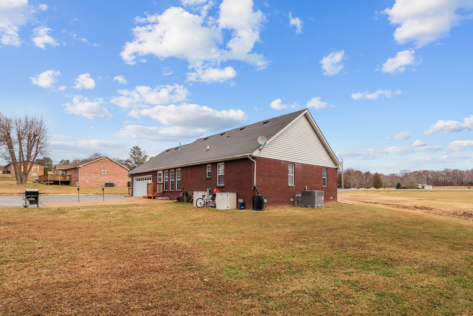 1714 West Grab Creek Road Dickson, TN 37055 - Photo 26 of 26 a view of a house next to a big yard with large tree