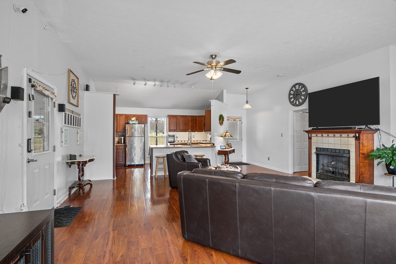 1714 West Grab Creek Road Dickson, TN 37055 - Photo 9 of 26 a living room with furniture a fireplace and a flat screen tv